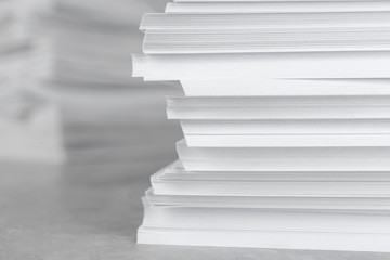 Stack of blank white paper on table, closeup. Space for text