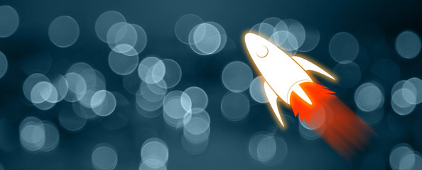 White rocket launch on dark blue background