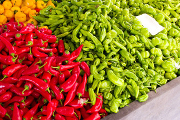 Fresh red and green bell peppers in the market