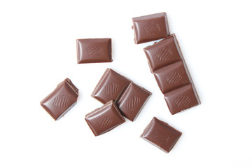pieces of chocolate isolated on white.