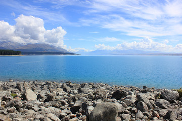 glassy and blue lake pukaki in new zealand