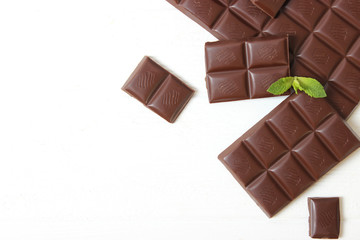 Pieces of chocolate on the table.