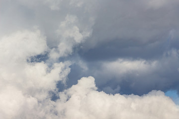 White and dark storm clouds close up_
