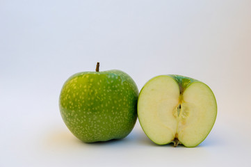 Ripe Green apple fruit with apple half  isolated on white background