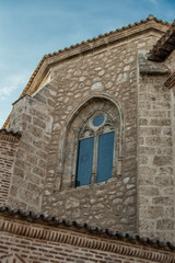 Fototapeta na wymiar gothic window on the stone facade of a church in Spain