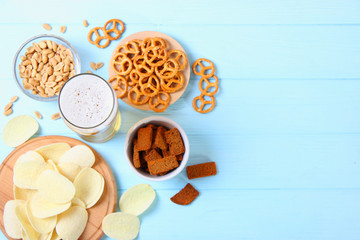 Beer and snacks on the table top view.