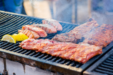 BBQ ribs and grilled fish  with lemon slices