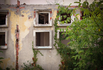 Fototapeta na wymiar Abandoned old ruined dilapidated building 