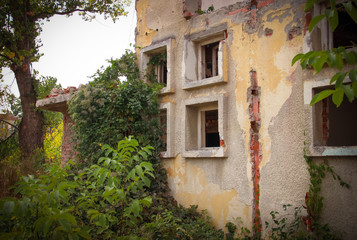 Fototapeta na wymiar Abandoned old ruined dilapidated building 