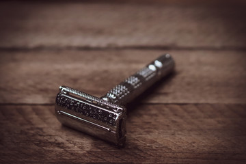 environmentally friendly shaver without plastic on a wooden background