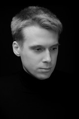 Black and white large portrait of a pensive young man