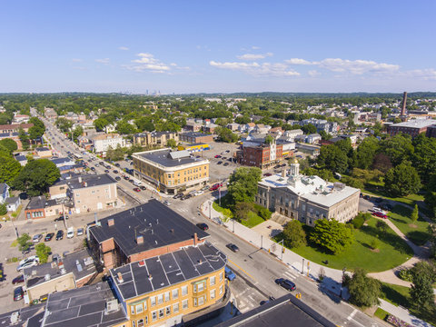 Waltham City Hall And Downtown With Boston Skyline At The Background Aerial View In Downtown Waltham, Massachusetts, MA, USA.