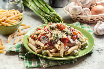 Penne pasta with asparagus and mushroom