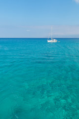 Obraz premium Cyprus blue lagoon with sailing boat