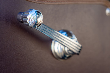 Vintage window crank from classic car.