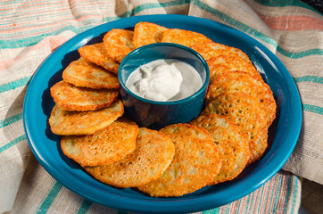 Homemade potato pancakes, latkes, draniki, hash browns or fritters served with sour cream....