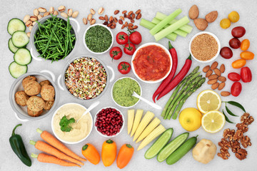 Health food for a vegan diet with falafel meat ball substitute, fruit, vegetables, seeds, nuts & dips. High in vitamins, minerals, antioxidants, anthocyanins, protein, fibre, omega 3 & smart carbs.  