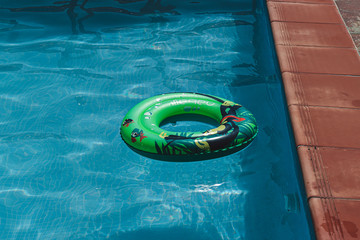 Fototapeta na wymiar A floater in a swimming pool, enjoying, Portugal