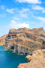 Fototapeta na wymiar Stunning cliffs in Ponta de Sao Lourenco, Madeira Island, Portugal captured on vertical picture. The easternmost point of the island of Madeira, volcanic landscape by the Atlantic ocean