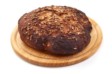 Round freshly baked rustic rye bread, traditional rye loaf, isolated on white background