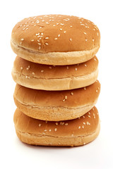 Delicious burger buns with sesame seeds, ingredients for burger, isolated on white background
