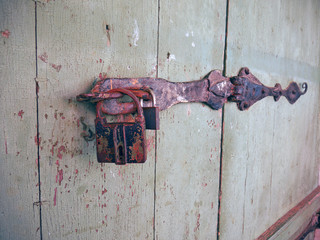 old rusty padlock on a door