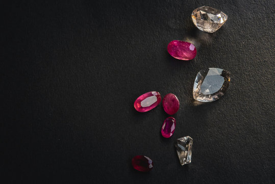Collection of Red ruby and topaz, Precious stones for jewellery on black background