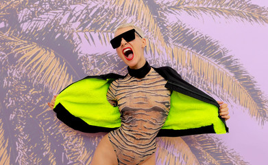 Freak blonde model in a fashionable body.Accent for animal print and clubbing stuff