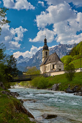 Scenic mountain landscape in the Bavarian Alps with famous Parish Church of St. Sebastian in the village of Ramsau, Nationalpark Berchtesgadener Land, Upper Bavaria, Germany
