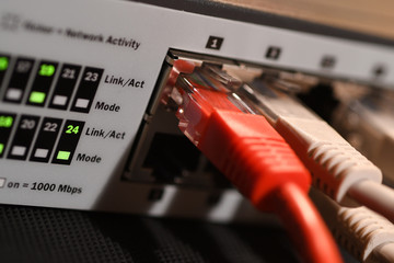 Detail of Lan Cables Rj45 and lights on network switches. Macro Shot.