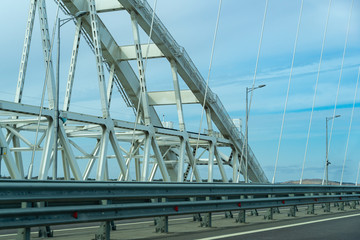White arches of new Crimean Bridge, also called Kerch Bridge, through Kerch Strait to Crimea. Automobile and railway bridge connecting Taman and Kerch.