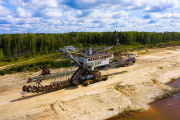 old rusty multi bucket excavator, giant stacker, absetzer in sandy career
