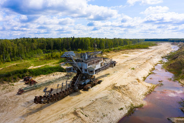 old rusty multi bucket excavator, giant stacker, absetzer in sandy career