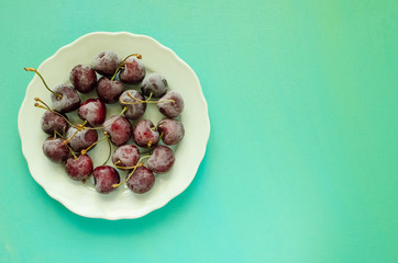 cherry berries cherries frozen by frost on a bright background