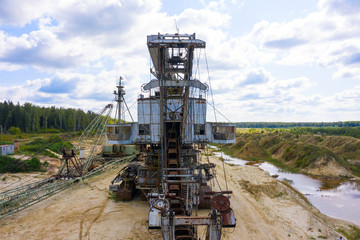 old rusty multi bucket excavator, giant stacker, absetzer in sandy career