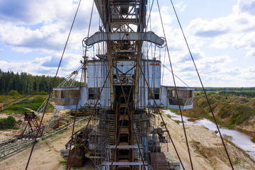 old rusty multi bucket excavator, giant stacker, absetzer in sandy career