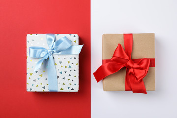 Beautiful gift boxes on two tone background, top view
