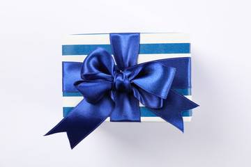 Beautiful gift box with bow on white background, space for text
