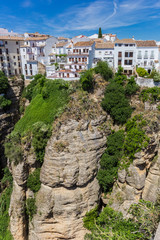 Fototapeta na wymiar White houses on the cliffs of historic city Ronda, Spain
