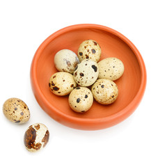 Guail eggs in bowl isolated on white background.