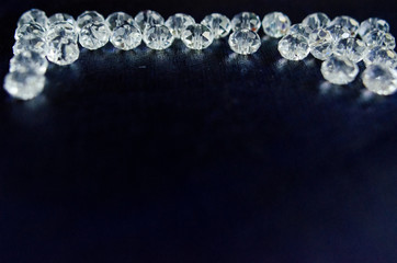 diamonds crystal glass beads on blue background