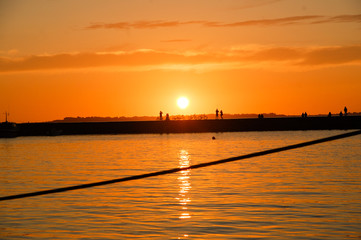 People enjoying sunset hour in Bergen harbour