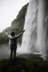 man in waterfall