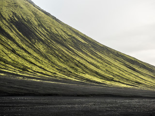 Moss covered black volcanic mountains near Langisjor Iceland