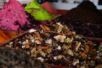 Multi-colored dried fruits and tea in the oriental bazaar.