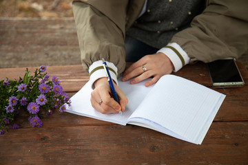 girl holding a pen in her hand. place for text.
