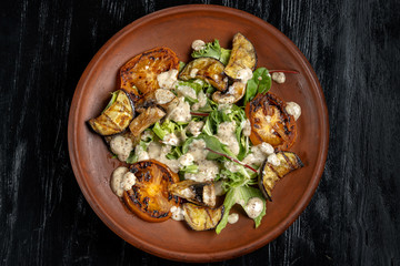 Grilled vegetable salad. Salad of barbecued zucchini, eggplant, onion.