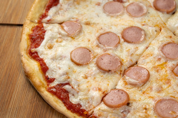 Homemade pizza with tomato sauce and cheese.