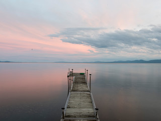 lake Champlaine at sunset and wooden pier