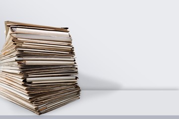 File folders with documents on white table